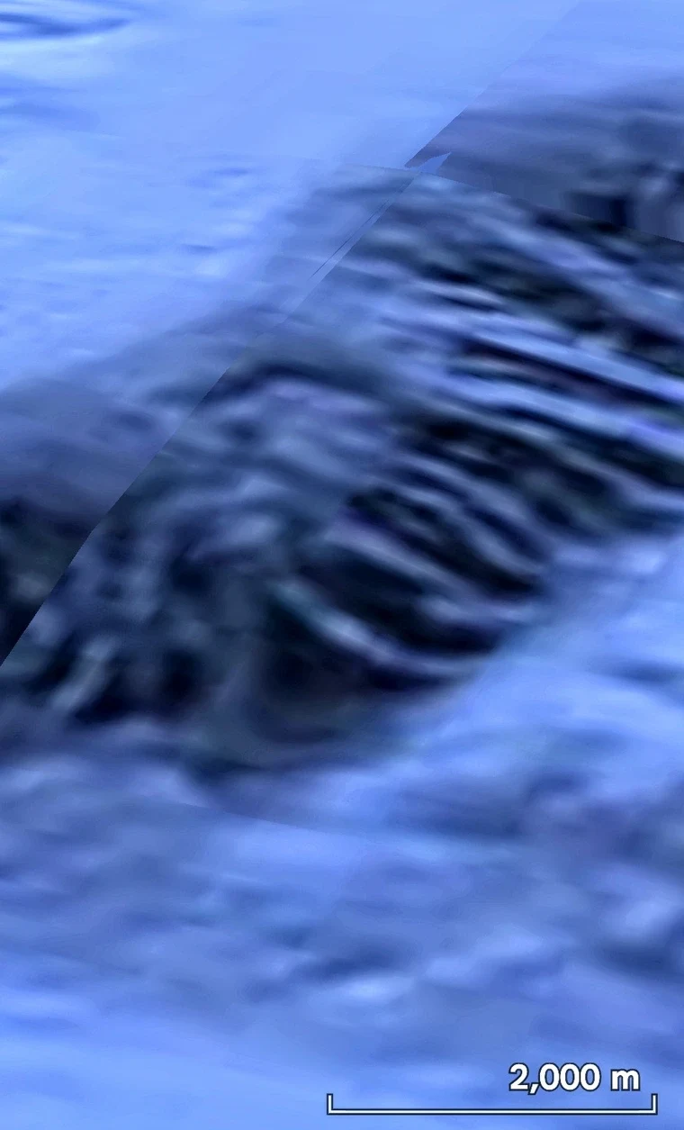 Feathered, ridge-like formations spanning about 2,000 meters across the seafloor (scale bar shown).