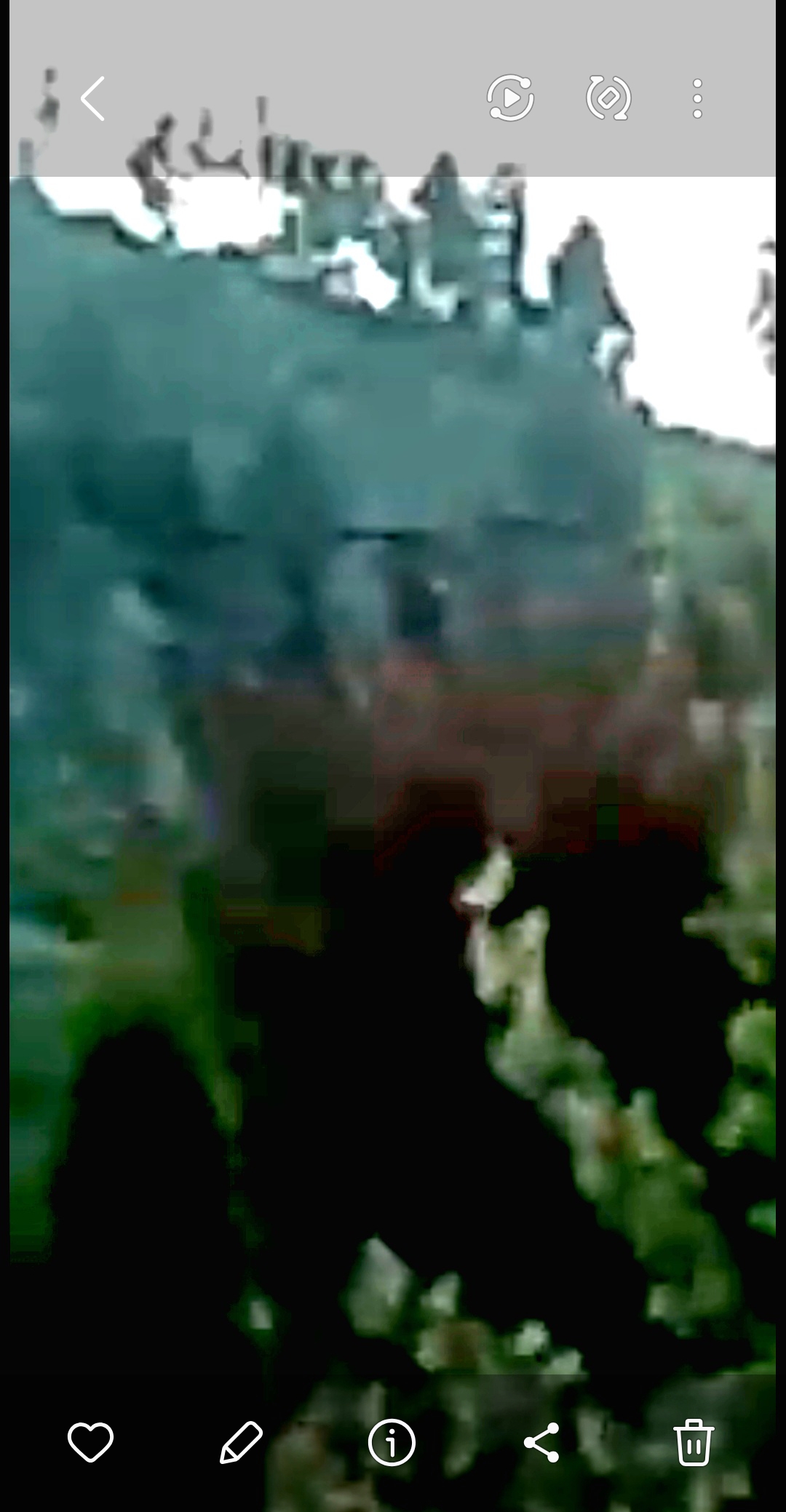 Giant head floating in the air above a house across the street from Estey's home watching the Perceiver