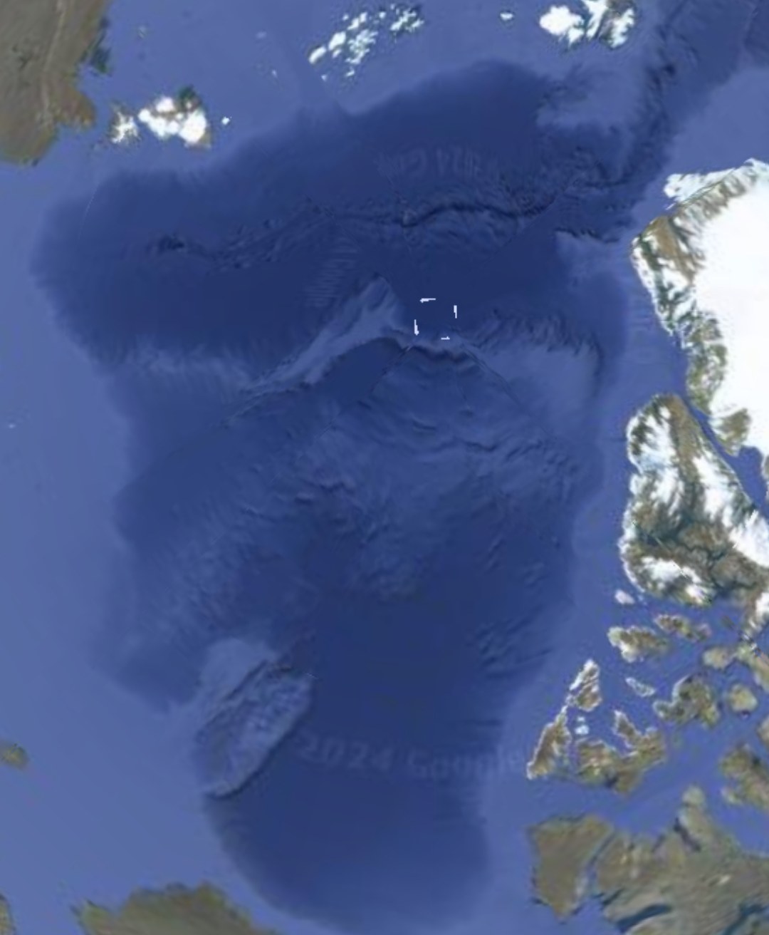 Satellite view of the Greenland coastline showing the elongated expansion phase of the pulsing dot formations stretched out in length before returning to compact formation