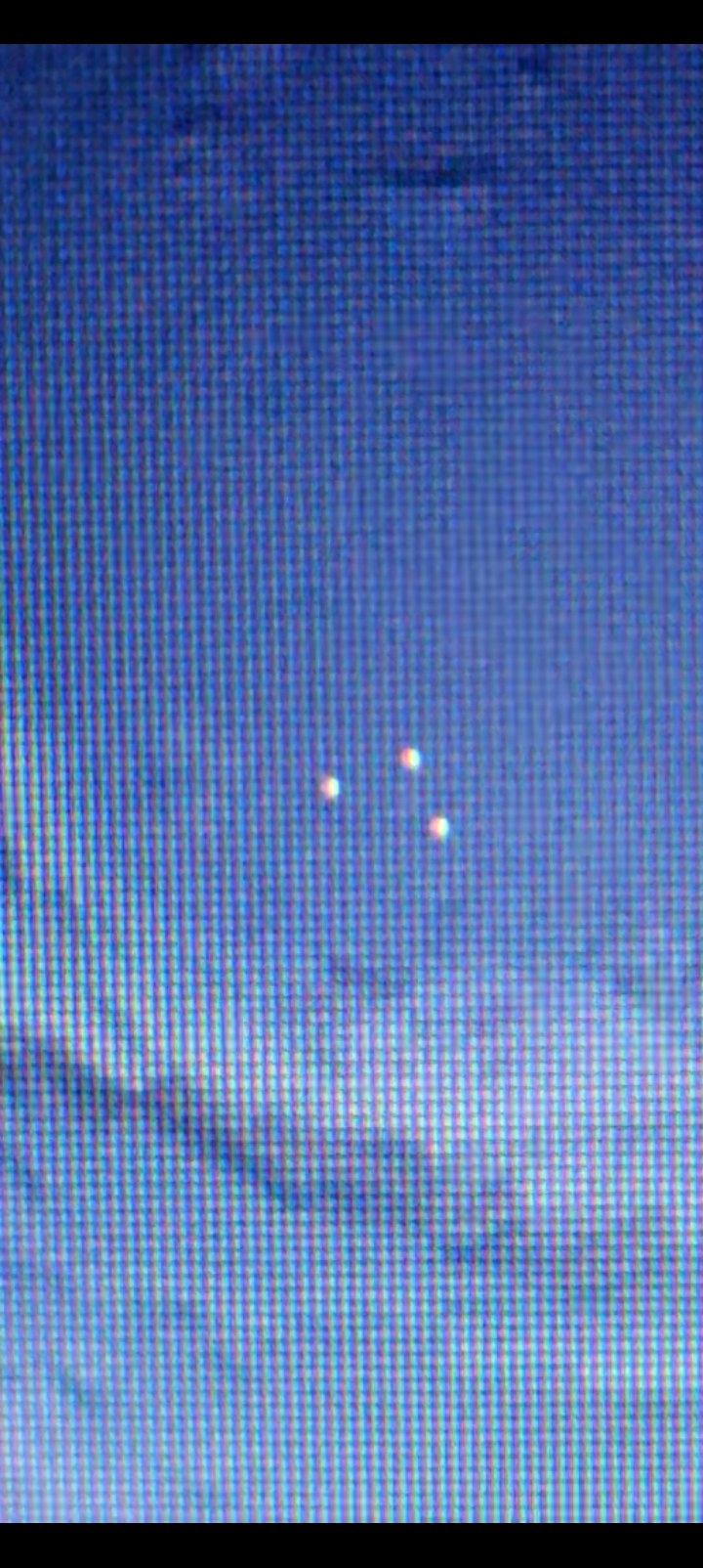 Three of the four pulsing dots captured in formation off the Greenland coast — the fourth was mid-pulse and out of phase at the moment of capture
