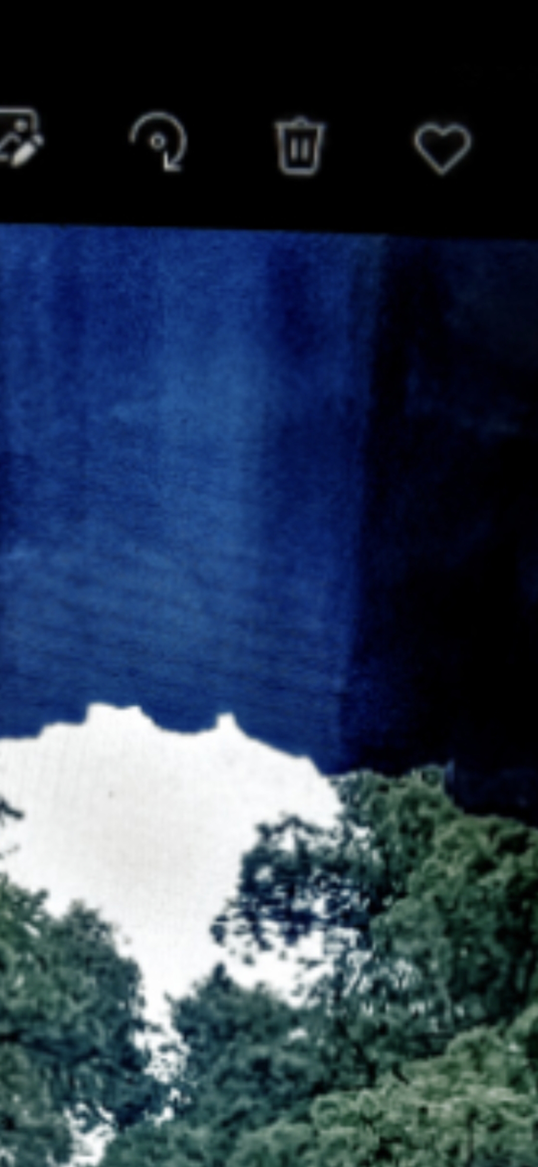 Blue energy manifestation portal guardian with faint alien face slanted eyes triangular head pointy chin visible in background