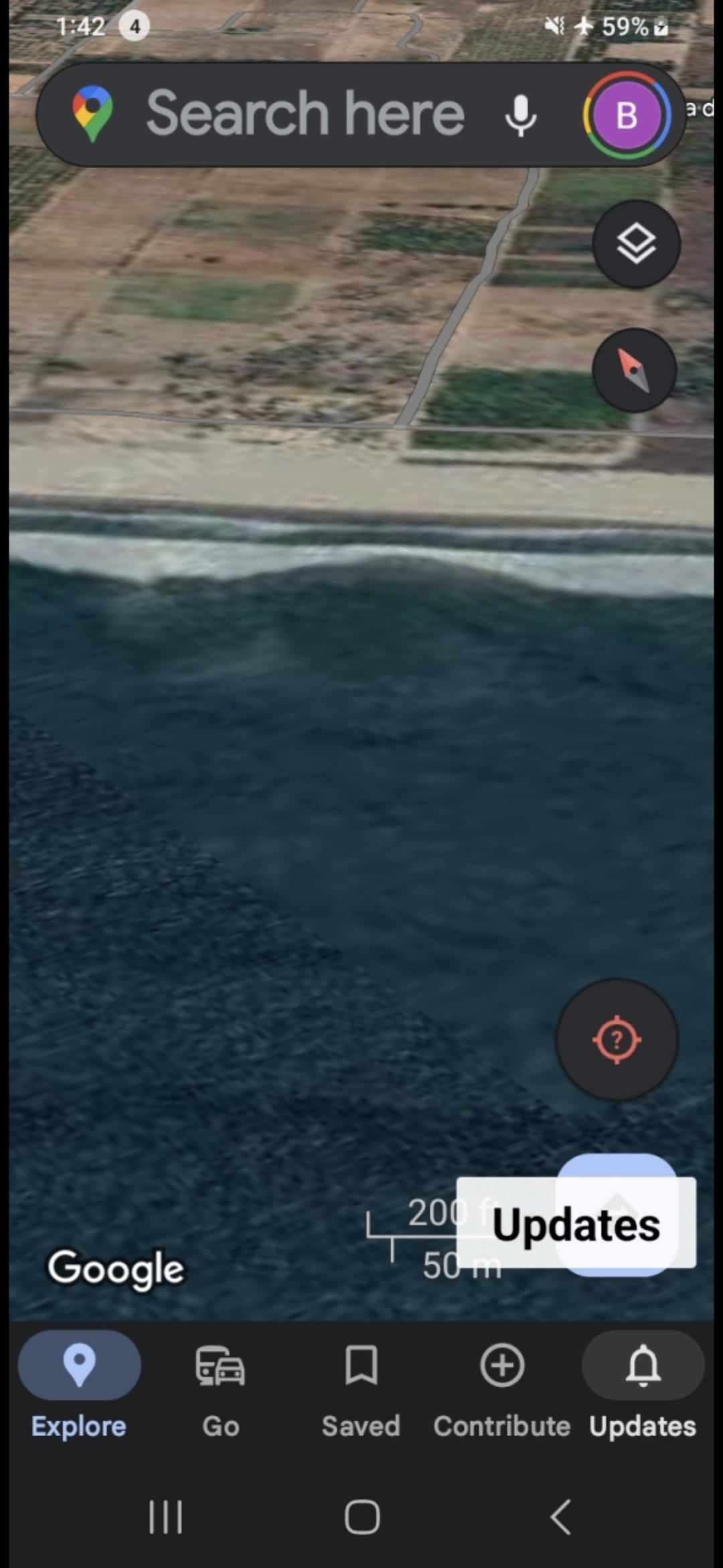 Mid altitude aerial satellite view showing the desert shore along Mazatlan Bay south coast meeting the deep blue Pacific water with the geometric submerged structure pattern visible offshore extending beneath the surface at the documented coordinate with the 200 foot 50 meter scale bar establishing the spatial dimension of the suspected base