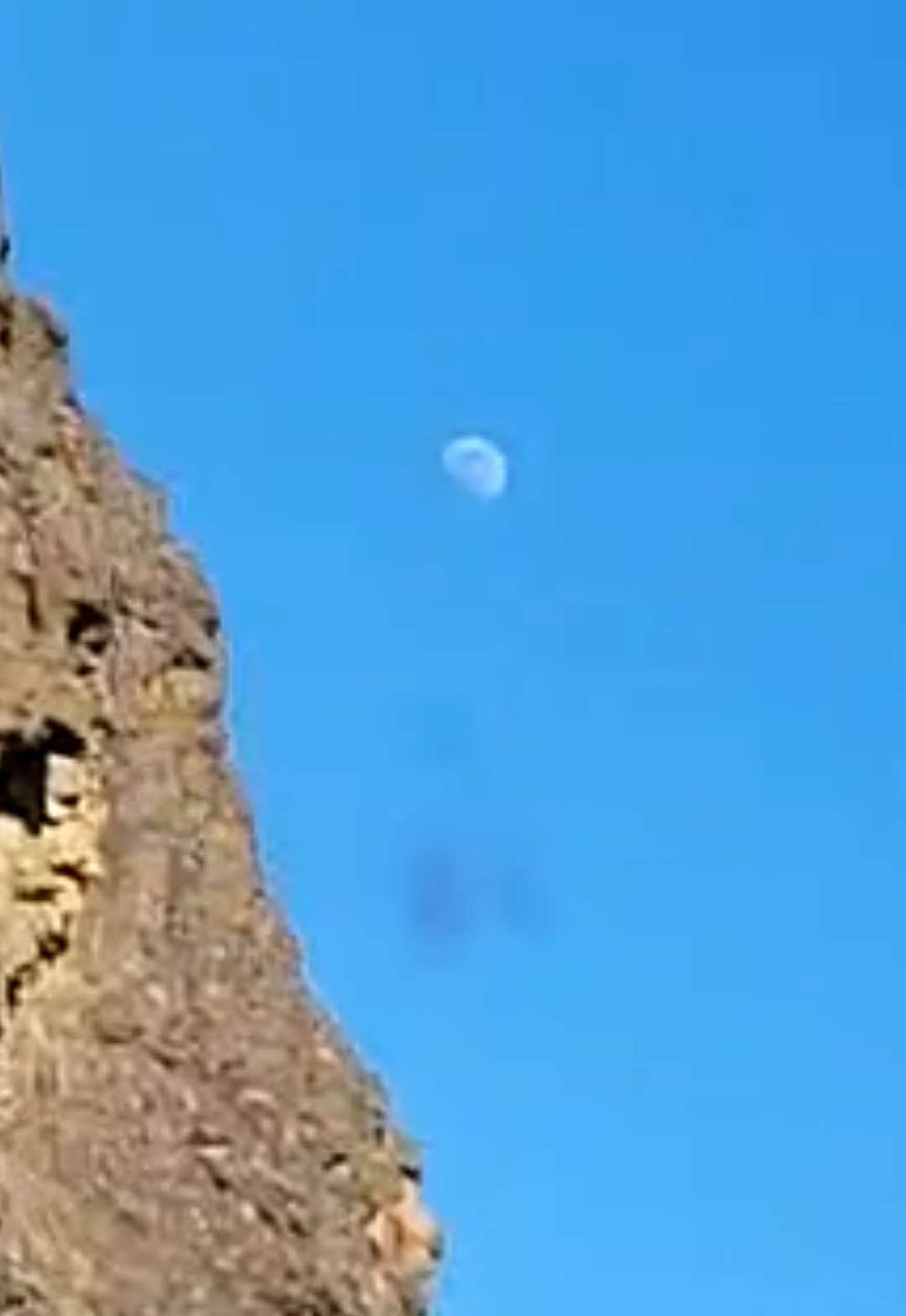 Environmental context establishing shot showing the luminous white object that appeared to be the moon above a forested mountain ridge along Highway 14 Columbia River Gorge on November 10 at 3:29 AM demonstrating the real-world location and timestamp of the observation