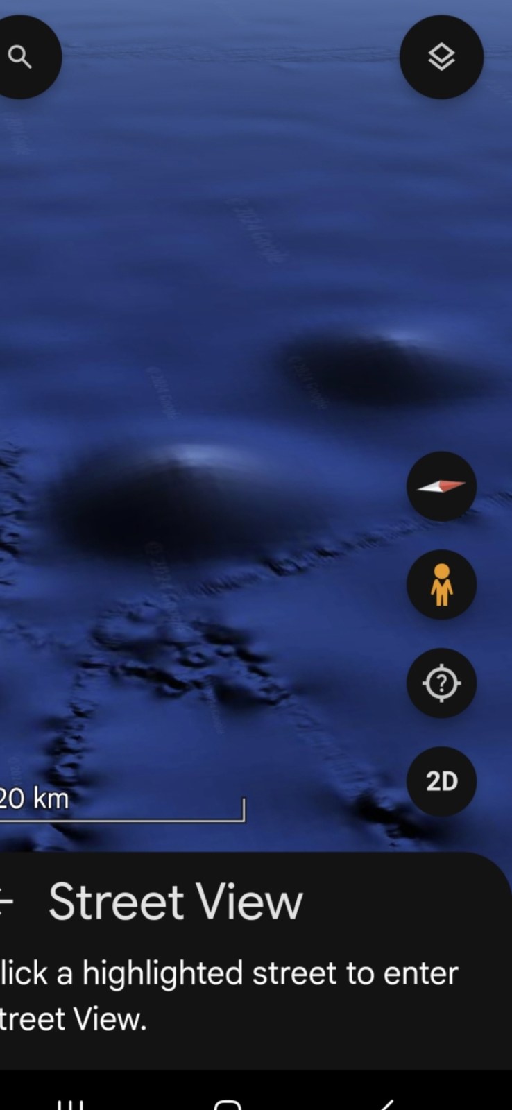 Pacific seafloor capture from Google Earth 3D imagery showing two distinct large dome-like structures rising from the deep ocean floor each ringed at the base by visible terrain disturbance with the 20-kilometer scale bar visible in the lower-left of the frame and Google Earth navigation UI elements present