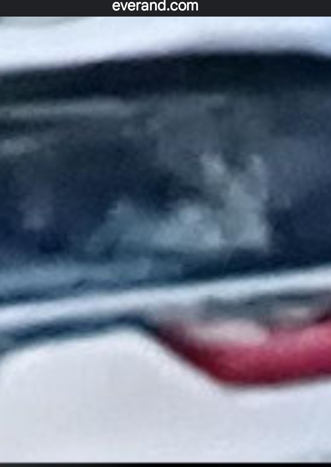 Close-up capture of female reptilian shape-shifter face inside the rear window of the pursuit vehicle showing first facial configuration