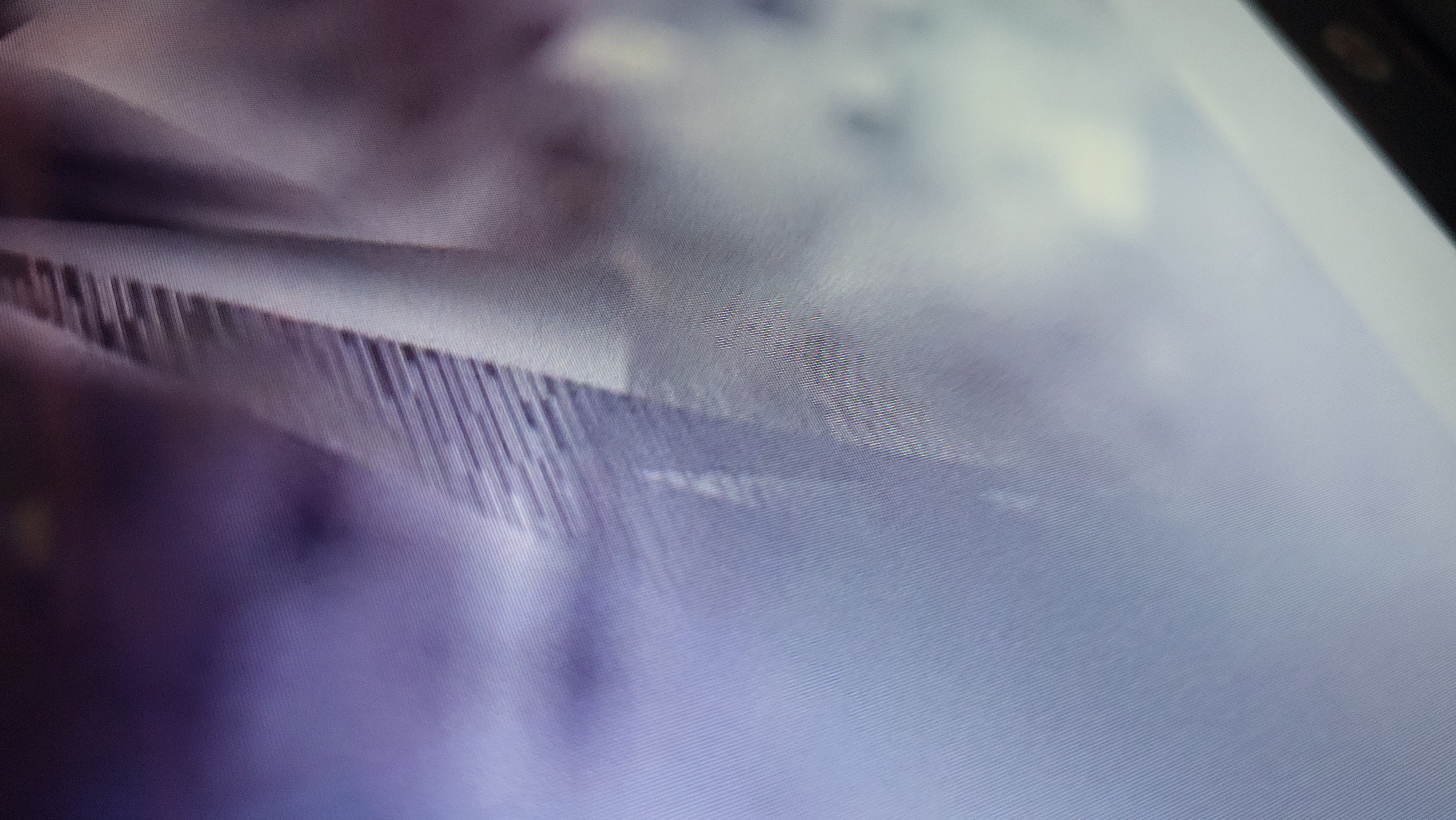 Alien crystal surveillance structure captured in the sky - purple and blue hued cloaked installation operating as part of the hidden atmospheric monitoring grid
