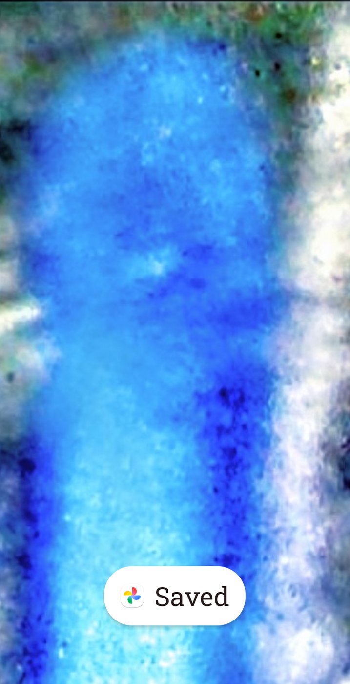 Extreme close-up zoom of the luminous blue UAP at Bridge of the Gods showing the entity's bright glowing body texture with deep blue and white tonal variations indicating high energy plasma signature