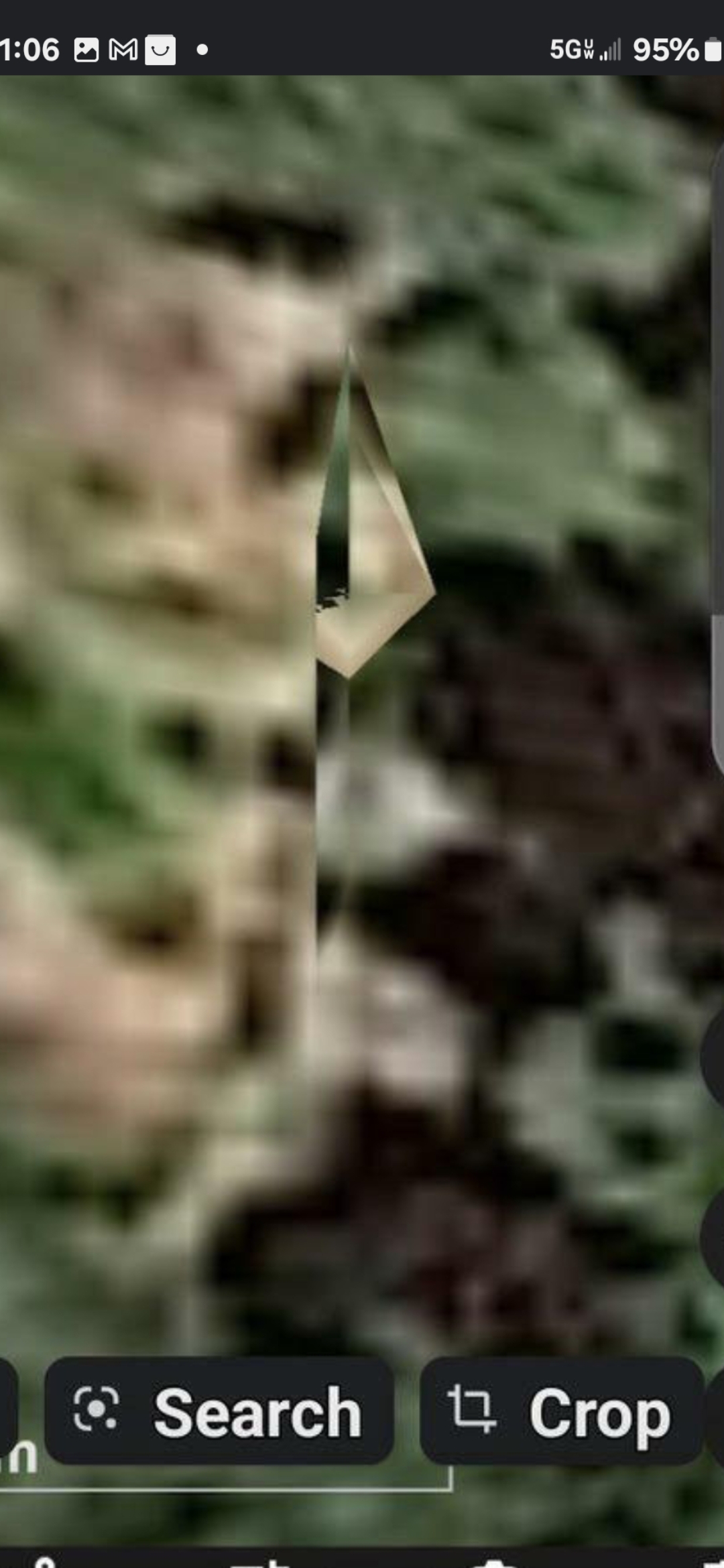 The Perceiver's canonical diamond crystal pyramid reference photograph showing a clean triangular pyramidal geometric form set against mottled green and brown terrain captured inside a Google Earth image viewer interface with search and crop buttons visible at the bottom of the frame representing the Underwood Mountain matched pair signature per the Perceiver's classification