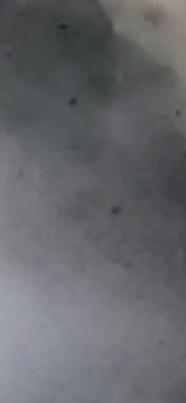 Underwood Hill nighttime particle drop showing two particles in a tight paired formation descending together from the facial cloud
