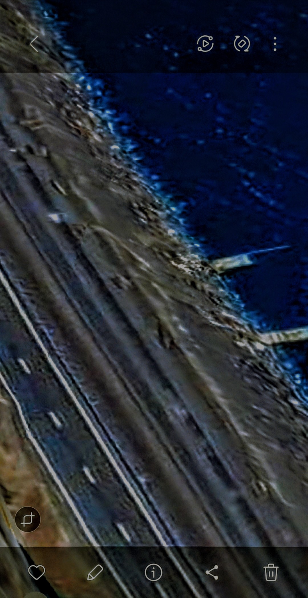 Camouflaged USO on Columbia River sandbank Washington side showing luminescent signature